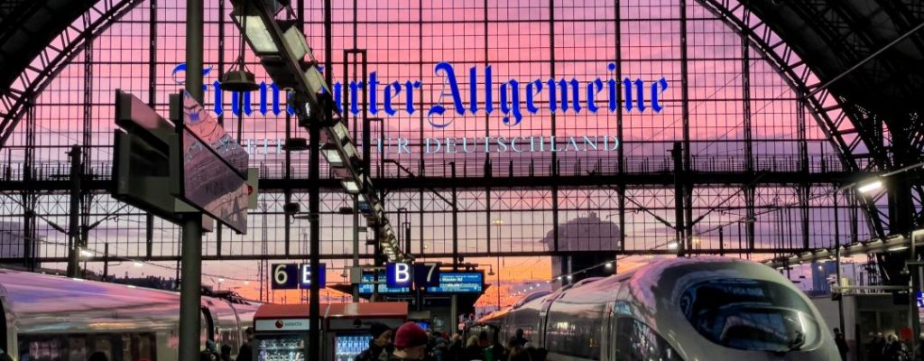 German station with iCE train