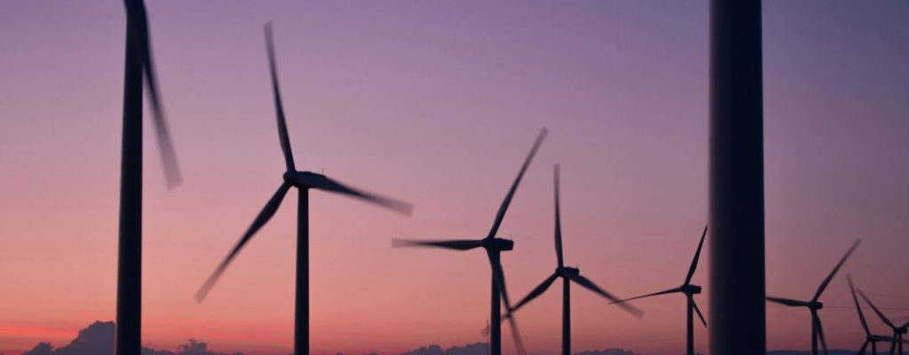 modern windmills in a purple sunset/rise