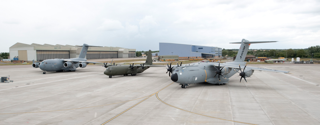 an image of three NATO military cargo planes